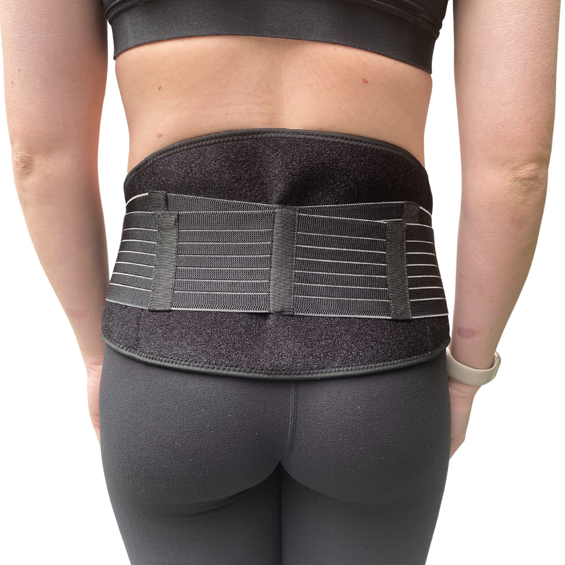 Pregnant woman putting on pregnancy pelvic belt for pelvic girdle pain