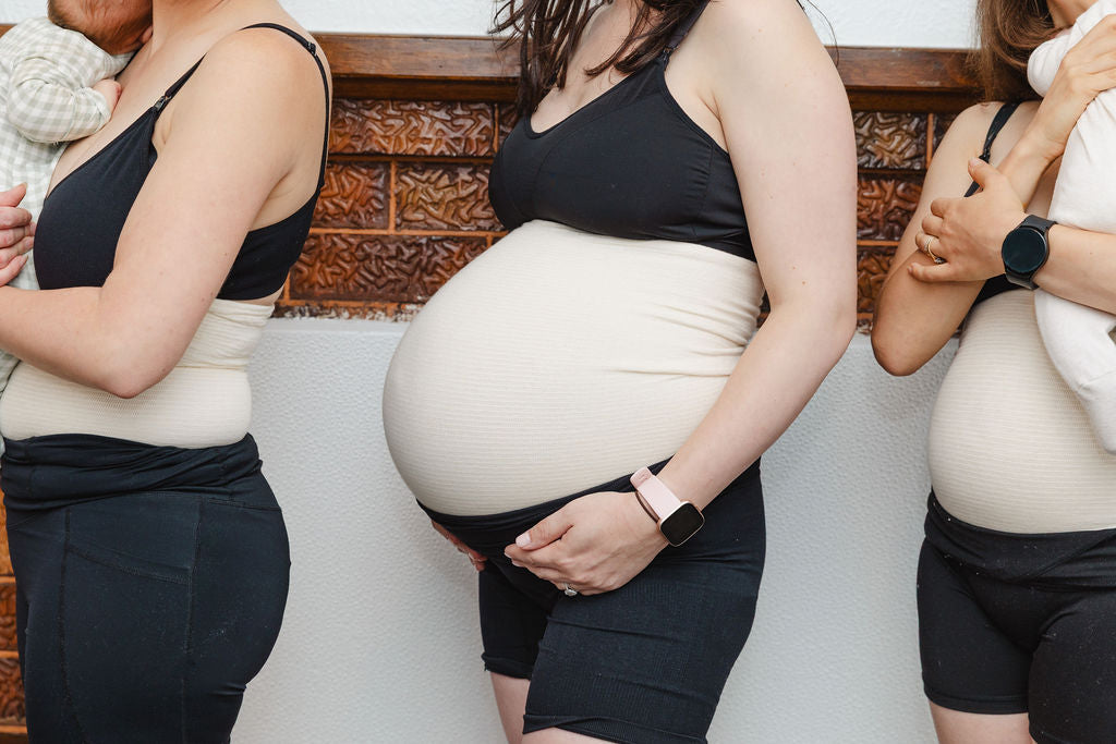 Three pregnant women standing side by side, holding their bellies.abdominal support garment, tubigrip