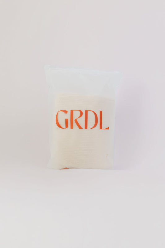 White abdominal tubigrip with 'GRDL' text on a white background