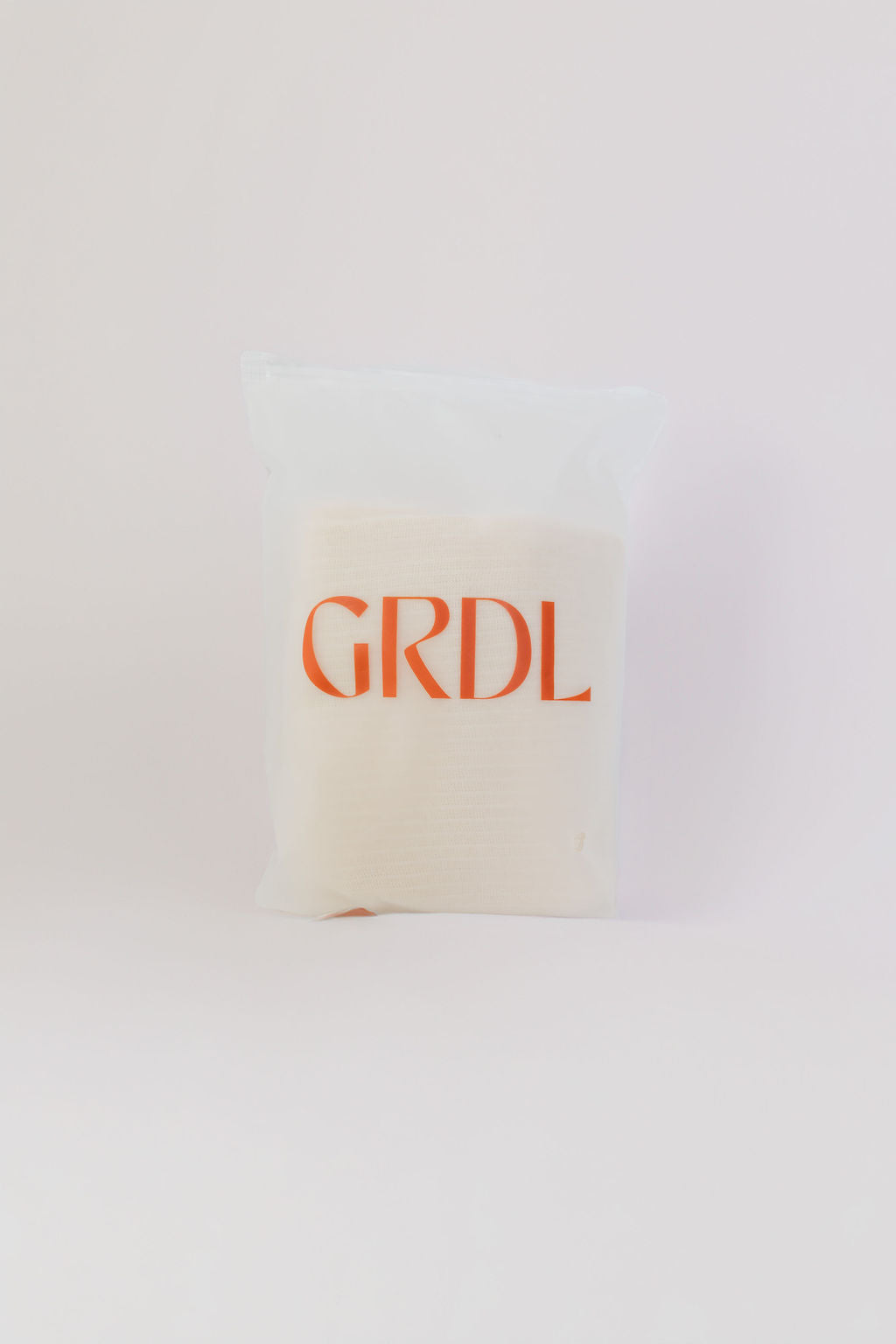 White abdominal tubigrip with 'GRDL' text on a white background